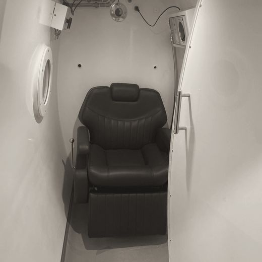 A single reclining seat inside an Executive Cube
