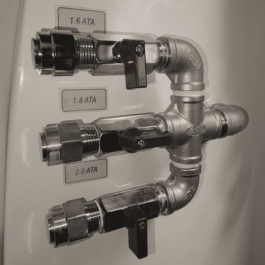 Steel pressure manifold with valves labeled 1.6, 1.8 and 2.0 ATA